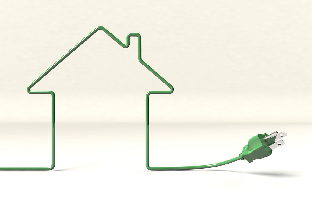 Outline of a house in a green electrical cord.